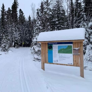 Atikameg trailhead in the winter, covered in deep snow.