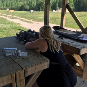 woman practicing at the gun range