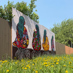 Jackie Traverse and Mary Duncan students painted this mural of three Indigenous women with roots to the ground