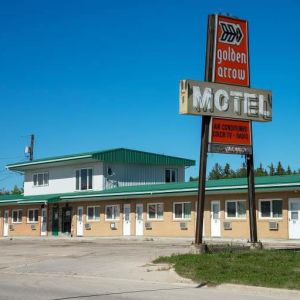 View of the motel from the outside with the original vintage sign