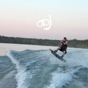 Aman wakeboarding in the evening on Clearwater Lake