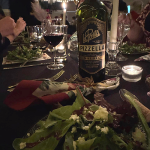 dimly lit table, set for a fancy diner and salad course