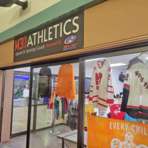 Store front from inside the mall, displaying jerseys