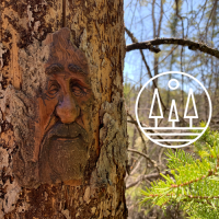 Smiling tree spirit with with Rosie Mayne Trail logo